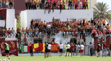 a group of people standing on top of a building with a banner that says ' n' city 1000 '