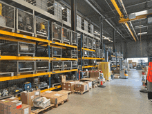 a large warehouse filled with lots of boxes including one that says ' a ' on it