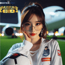 a girl wearing glasses holds a soccer ball in front of a museum bola sign