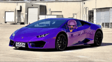 a purple sports car with the word moon sama on the front