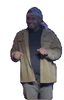 a man wearing a hat and a jacket is pointing at something