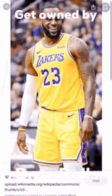 a basketball player wearing a yellow lakers jersey