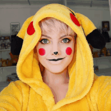 a woman is wearing a pikachu costume and has red spots on her face