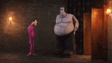 two cartoon characters standing next to each other in a dark room