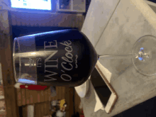 a wine glass that says it 's wine o'clock