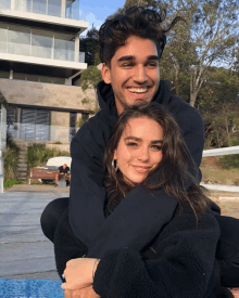 a man and a woman are posing for a picture