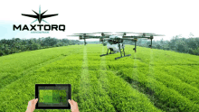 a person holding a tablet in front of a drone that says maxtorq aerospace