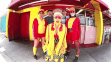 a group of people standing in front of a restaurant with the words " it 's nasty " written on the bottom