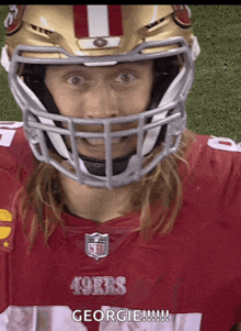 a football player wearing a 49ers jersey and helmet