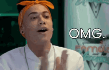 a man wearing an orange headband says omg in front of a green background