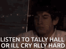 a man says listen to tally hall or ill cry rlly hard in a dark room