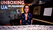 a young man is standing in front of a piano with the words " unboxing ua figurines " written above him