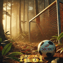 a soccer ball with sbobet written on it sits in front of a soccer goal