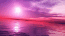 a sunset over the ocean with a purple sky