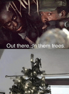 a christmas tree with a predator figurine on top of it