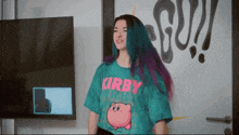 a girl with purple hair wearing a kirby shirt