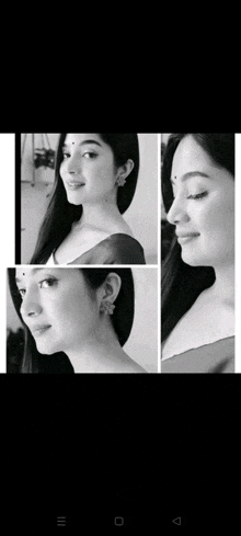 a black and white photo of a woman wearing earrings and a bindi .