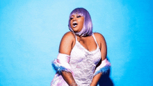 a plus size woman wearing a purple wig and a pink bodysuit is standing in front of a blue background .