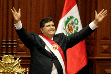 a man with his arms outstretched in front of a flag with the number 80 on it