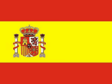 the flag of spain is yellow and red with a coat of arms on it .