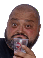 a bald man with a beard is holding a cup that says super bock