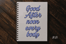 a notebook that says good after noon every body on it