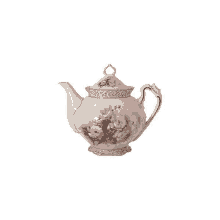 a white teapot with pink roses painted on it