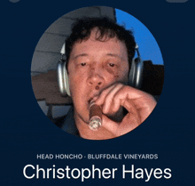 a man wearing headphones is smoking a cigar and has the name christopher hayes on the bottom