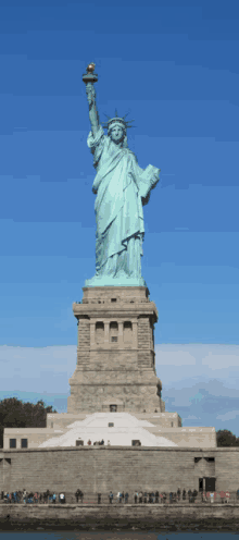 the statue of liberty in new york city stands tall over the water