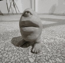 a black and white photo of a statue of a person 's face