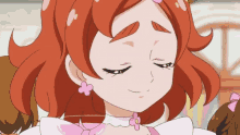 a close up of a cartoon girl with red hair and pink earrings