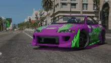 a purple and green sports car is parked on a street