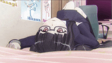 a girl laying on a bed with a poster that says hikawa