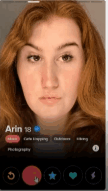 a woman with red hair is on a dating app called arin