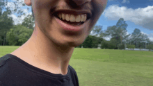 a close up of a man 's face with his teeth showing