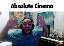 a man wearing headphones stands in front of a poster that says " absolute cinema "