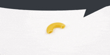 a piece of macaroni is on a white surface