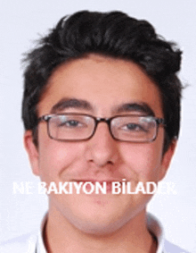 a young man wearing glasses with the words ne bakiyon bilader on the bottom of his face