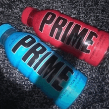 blue and red bottles of prime hydration drink