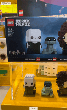 a box of lego brick headz harry potter