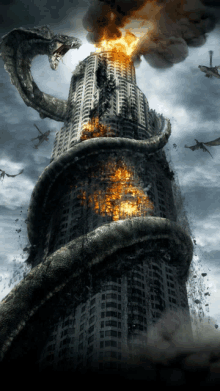 a very tall building is on fire with a snake coming out of it