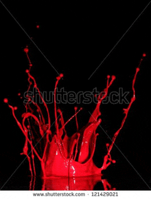 a splash of red liquid on a black background