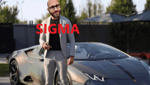 a man in a suit is standing in front of a sports car with the word sigma in red letters