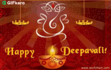 a happy deepavali greeting card with a candle in a bowl