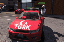 a red car with turk written on it