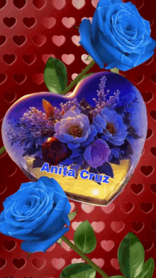 a heart shaped container with blue roses and the name anita cruz on it