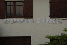 the word bienvenue is written on a white wall