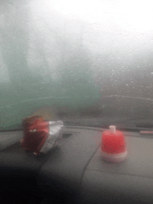 a red light on the dashboard of a car