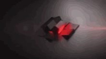 a bunch of red cubes are floating in the air on a dark background