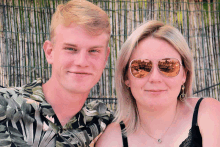 a man and a woman wearing sunglasses are posing for a photo